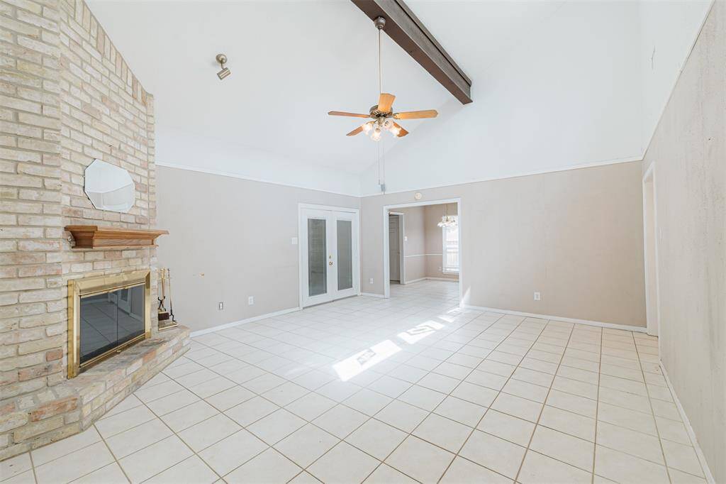 Curl up and enjoy your favorite movie or book sitting by the fireplace in the spacious living room.
