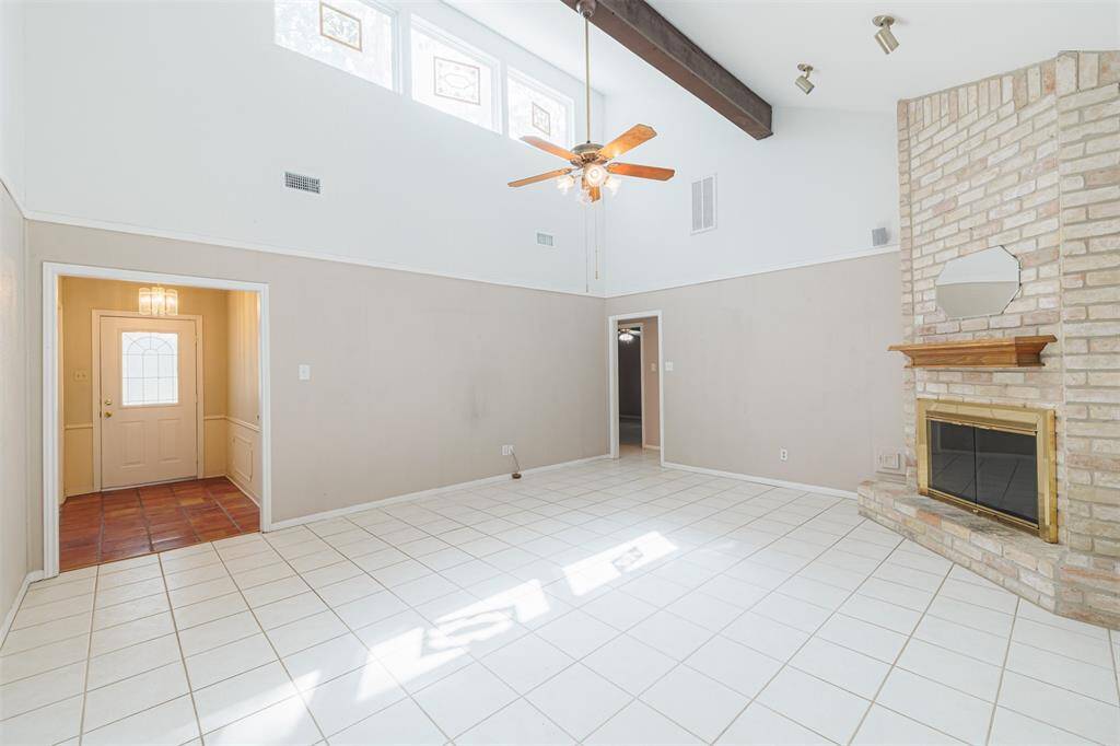Another view of the living room and the front entry.