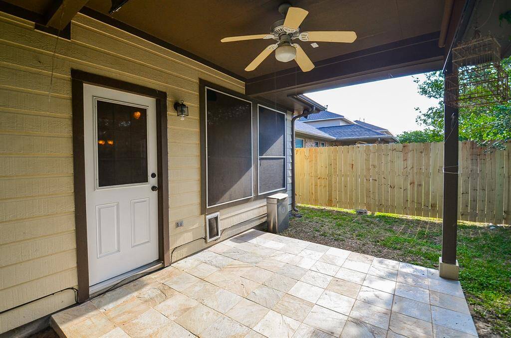 The covered patio provides a perfect setting for alfresco dining or simply unwinding after a long day