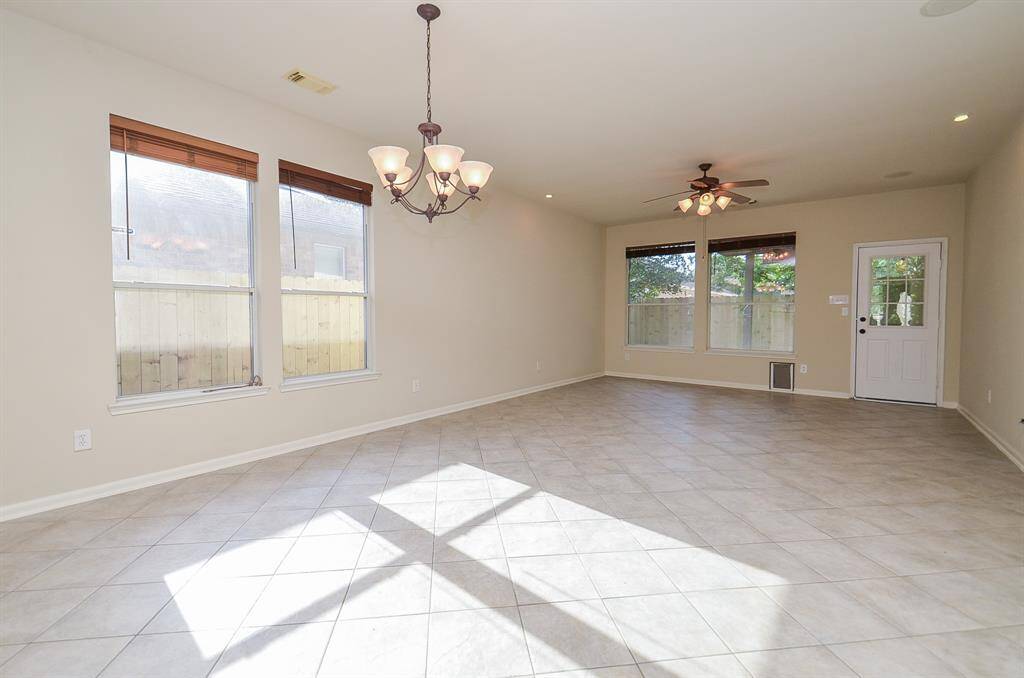 This spacious residence boasts an open-concept floor plan