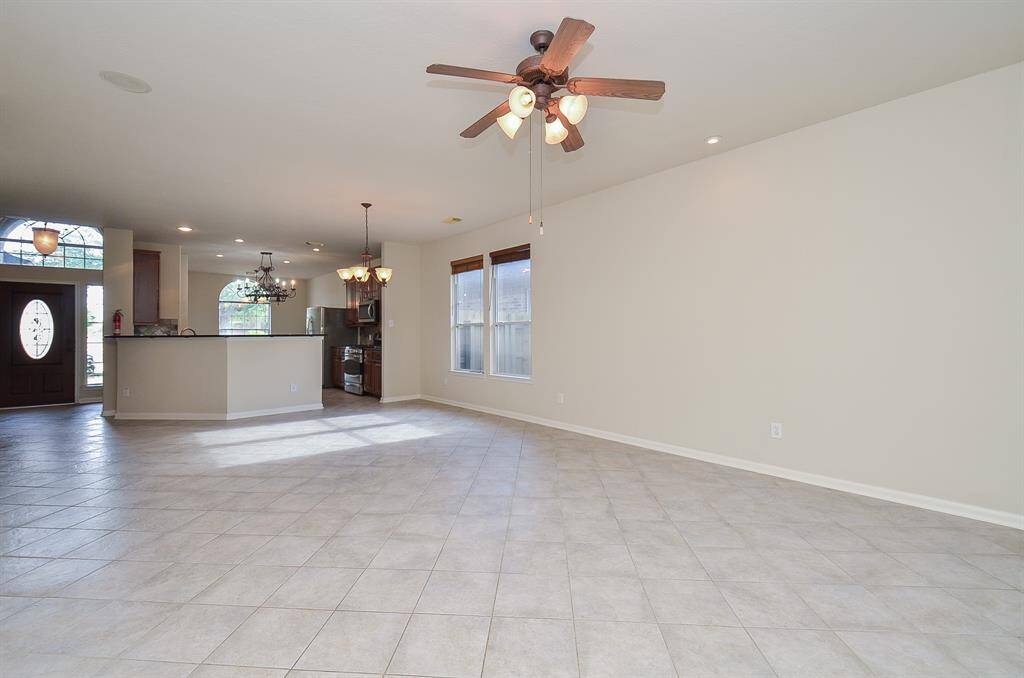 The living, dining, kitchen, and breakfast areas are seamlessly connected, creating a beautiful flow.