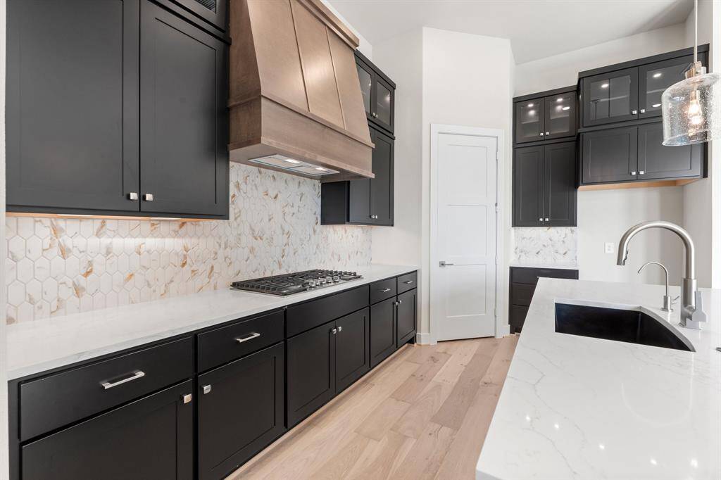 Gas Cooktop and Custom Wood Hood with Vent to Exterior