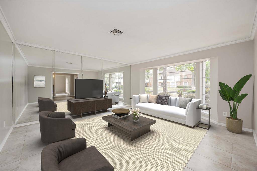 Formal living/flex room to the right when you walk in the home. Virtually staged