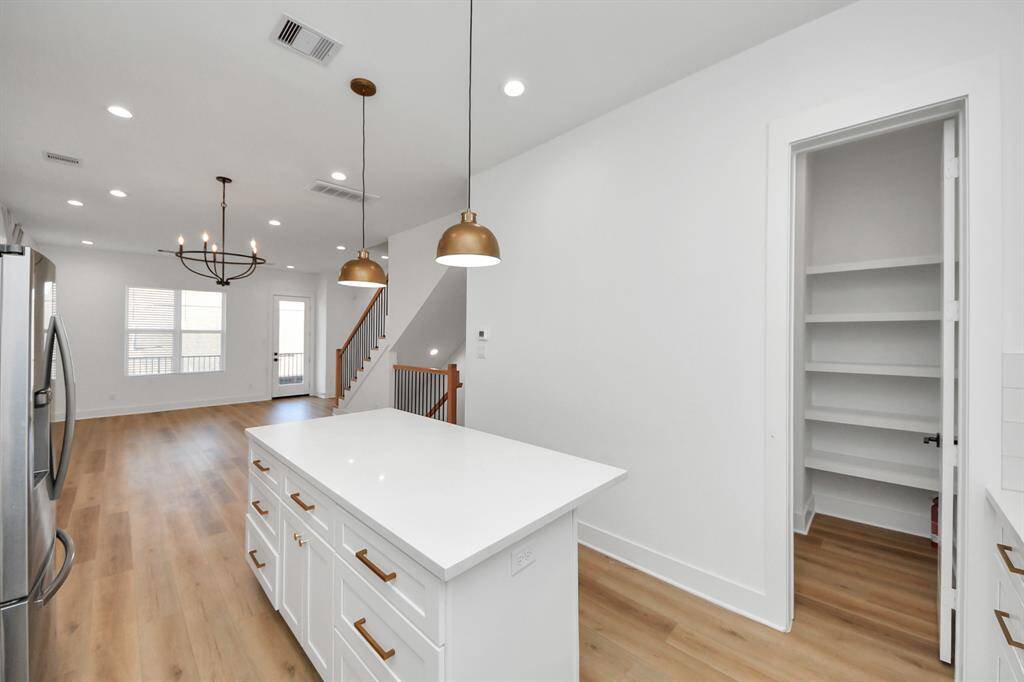 Not only this beautiful kitchen has amazing finishes, it also has a large walk-in pantry!