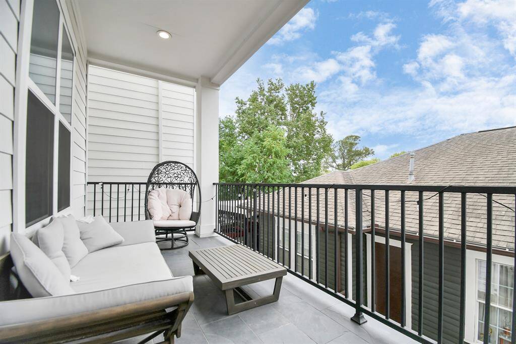 This covered balcony is perfect to enjoy your morning coffee or tea, or just relax with a book!