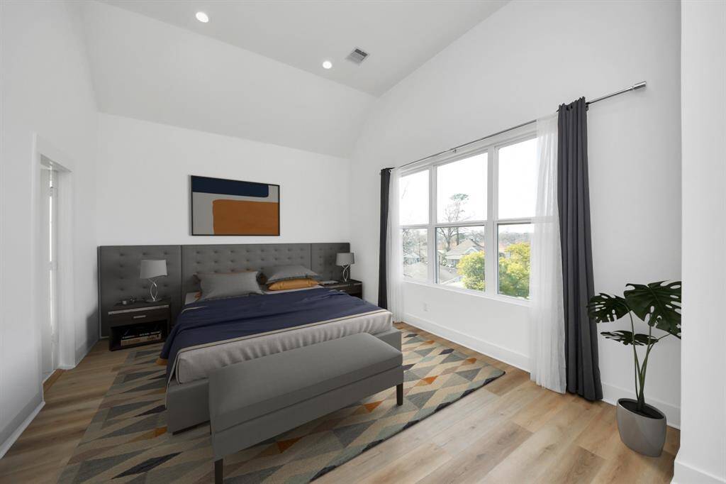 Talk about the perfect primary suite to come home to from a long day after work! This stunning primary bedroom features large windows, ample natural light, cathedral ceilings, extra space for seating or TV console. *Photo is virtually staged.