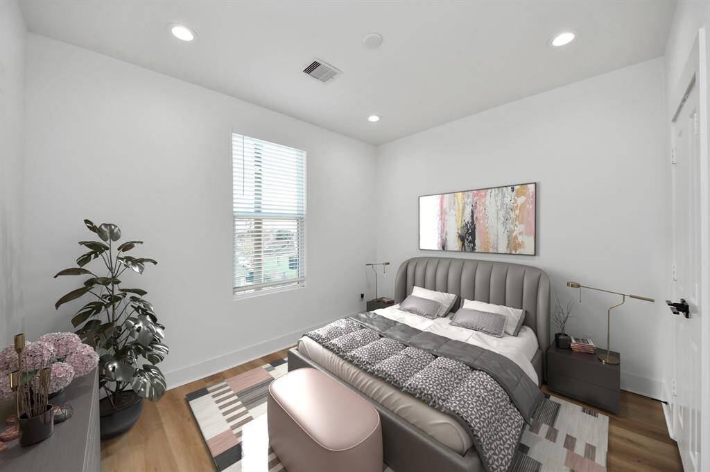 This secondary bedroom with an en-suite bathroom is perfect for guests!  *Photo is virtually staged.