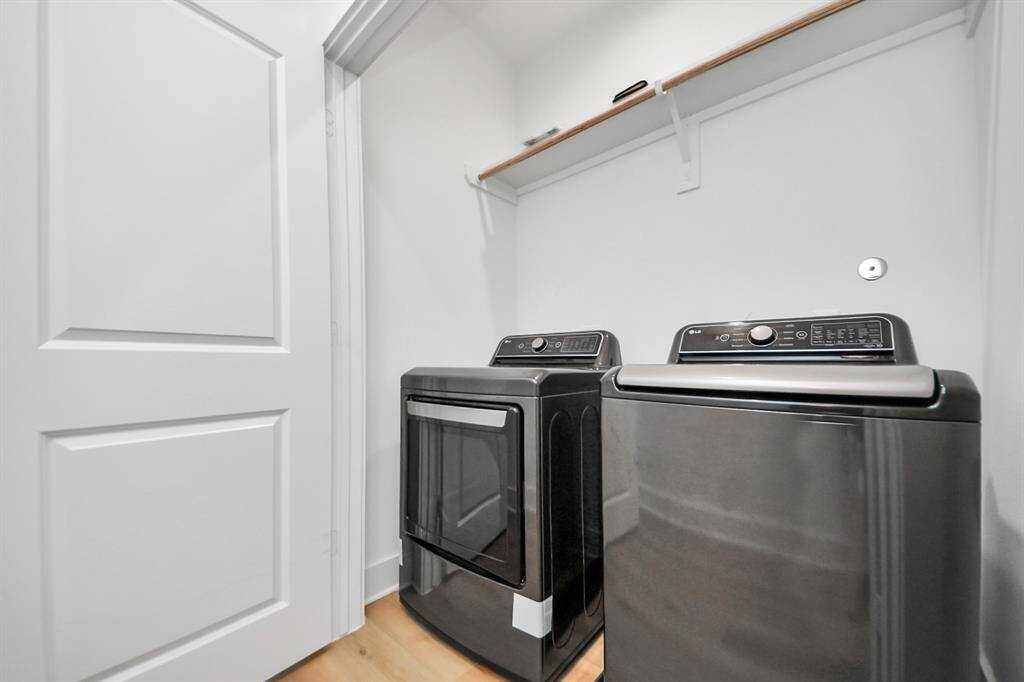 The laundry room is located on the third floor's hallway, next to the primary suite for convenience. Washer and Dryer are included!
