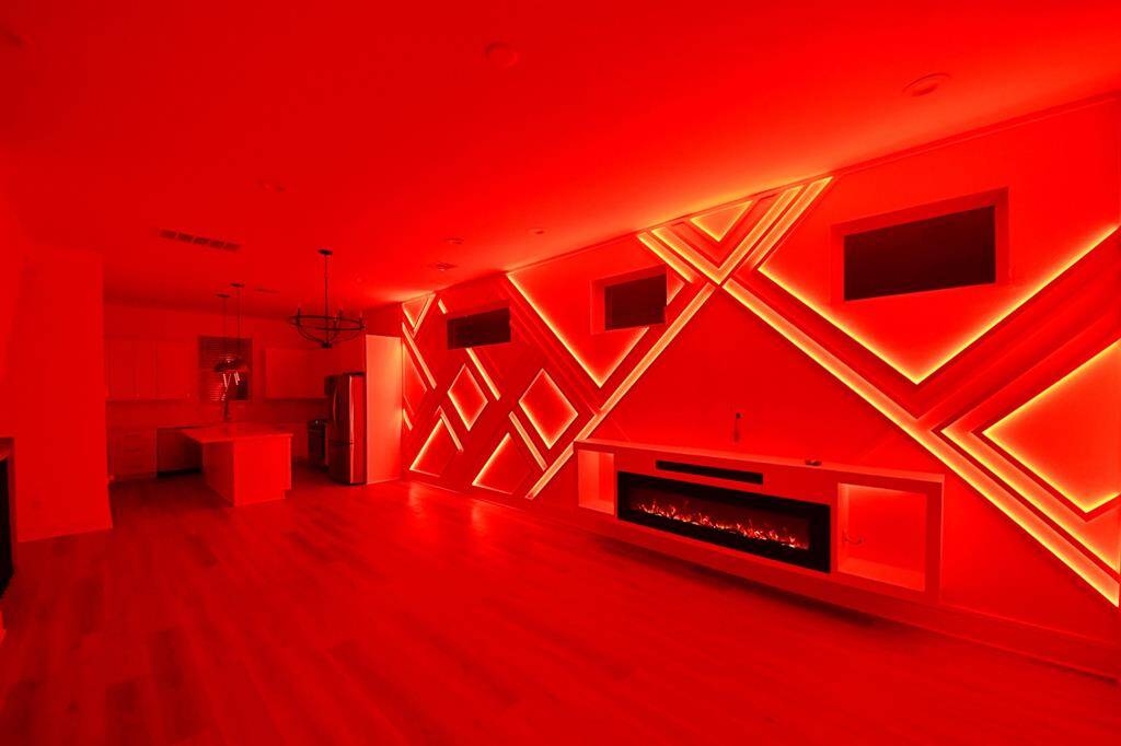 Entertain in style! Living room features a custom LED accent wall with built-in electric fireplace and sound bar. You can easily control the lights on your phone and it comes with multiple settings/colors.