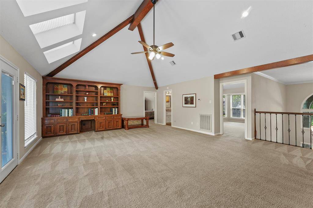Huge second floor game room with built-ins.