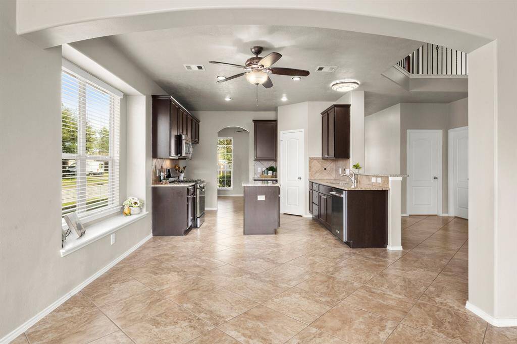 Breakfast room sits between the family room and kitchen for easy flow. The box seat window can be used for seating with a rectangular table or to display your treasures.