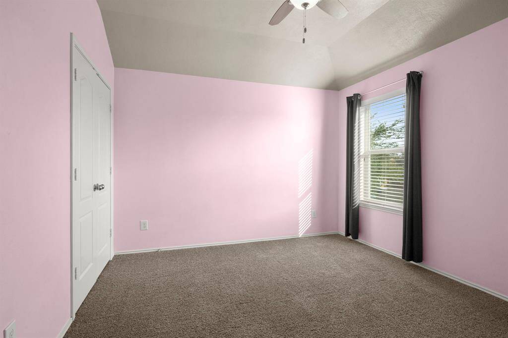 Bedroom 2 - Plush carpet, 2" blinds, ceiling fan and designer paint.