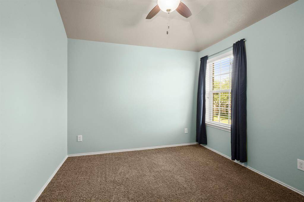 Bedroom 3 - Plush carpet, 2" blinds, ceiling fan and designer paint.