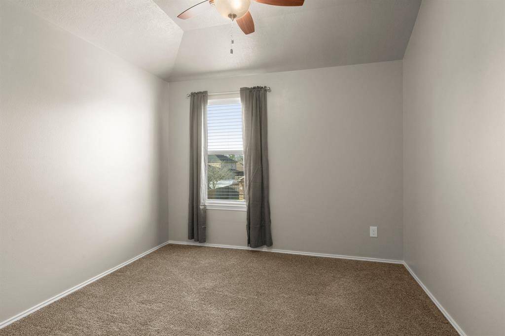 Bedroom 4 - Plush carpet, 2" blinds, ceiling fan and designer paint.