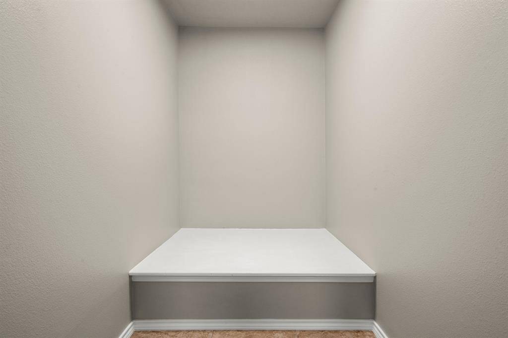 Huge storage closet was added by the homeowner. This area was previously a "look-over" into the foyer with a ledge for decoration (also known by many as a dust-catching ledge)... a much better use of space and storage!