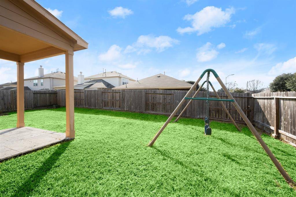 Back yard is ready for your pets, kids and weekend BBQs. Solid and recent swing set stays.