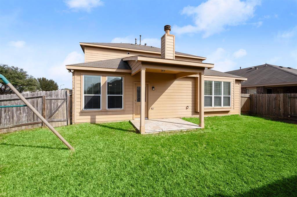 Back yard patio is tiled and ready for your morning coffee moments.