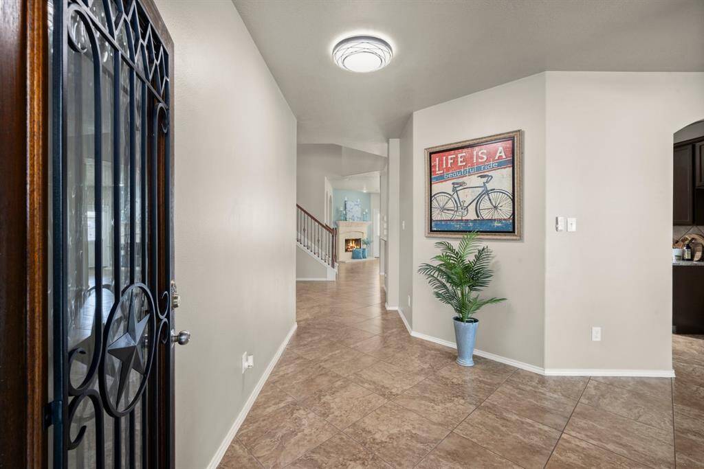 Large tile flooring sits on the diagnal and stretches throughout the downstairs main areas.