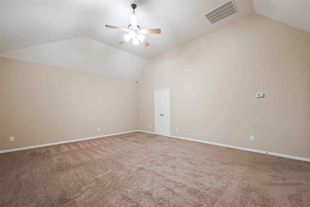 Huge primary bedroom with soaring ceilings for your private retreat.