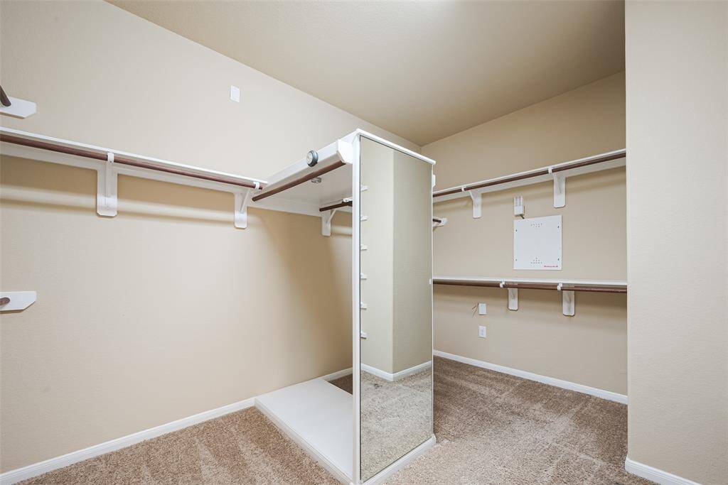 Huge walk-in closet with enough room for all of your wardrobe and more!