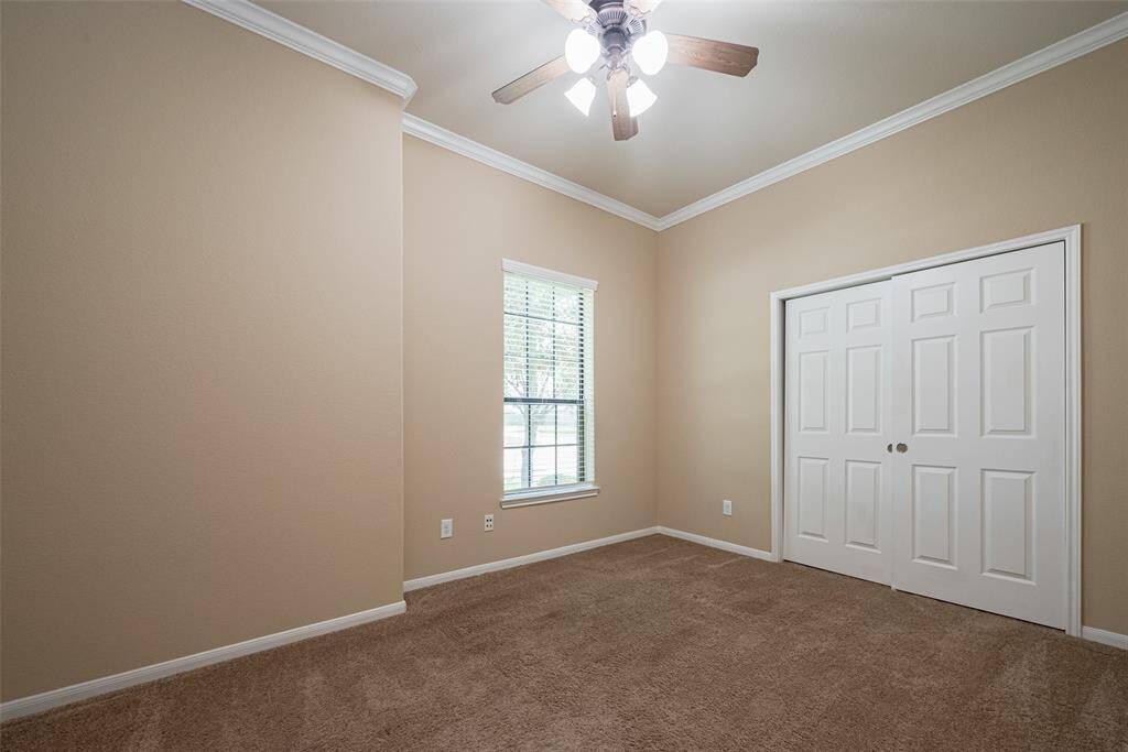 Corner bedroom with double windows and soft tones, large closet!