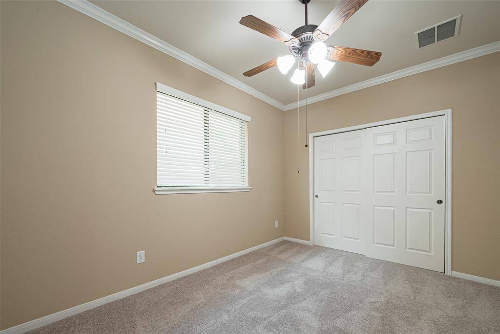 Spacious secondary bedroom with large window
