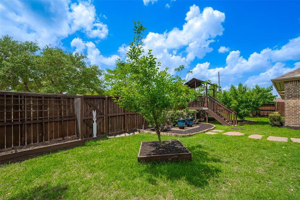 lush landscaping and mature fruit trees!