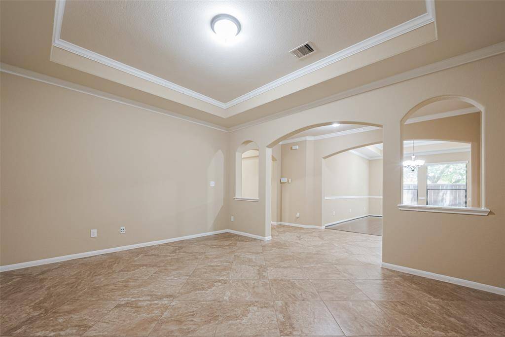 Bonus room for entertaining, central to open concept floorplan near kitchen, dining and living areas!
