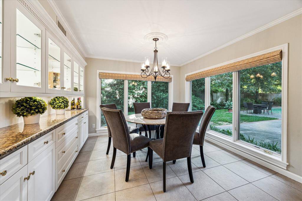 Breakfast Room with buffet, plenty of storage and lighted, glass front cabinets with glass shelves