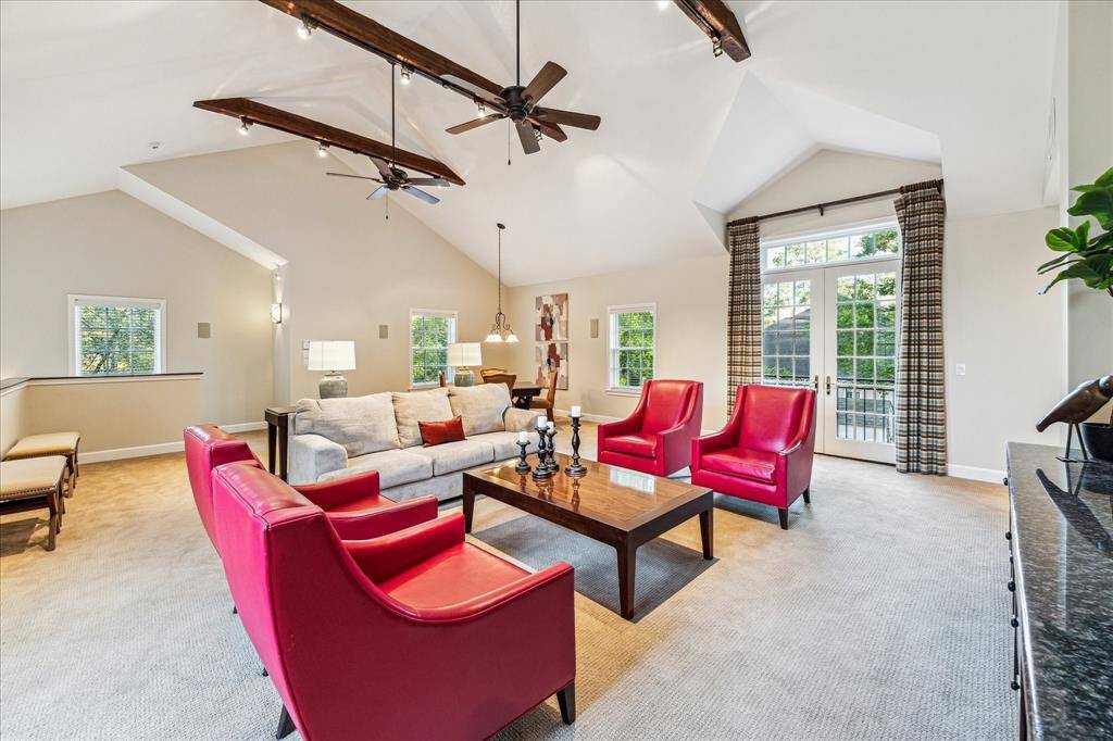 Game room over the garage with TV, surround sound, study nook, wet bar and bedroom and bath