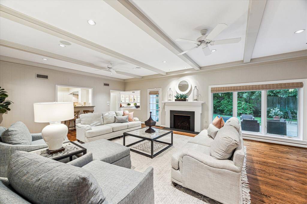 Family Room with beamed ceiling and hardwood floors