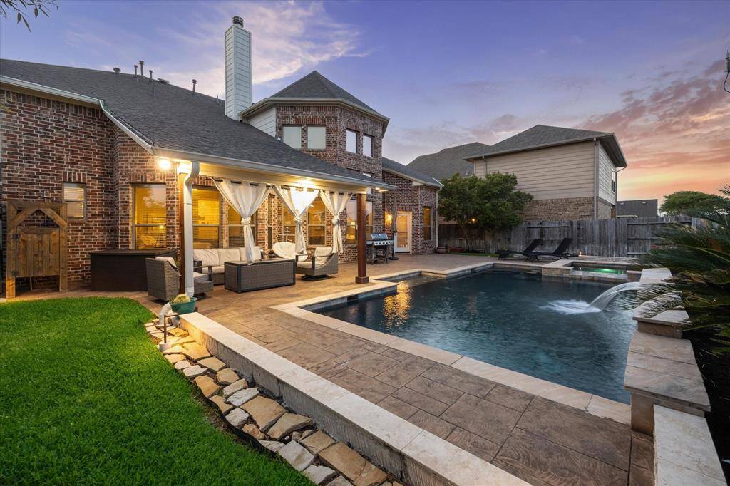 Backyard bliss unfolds at sunset with an entertainer’s dream patio, resort-style pool, and inviting lounge spaces. String up some lights, fire up the grill, and enjoy unforgettable nights in this beautifully designed outdoor escape.