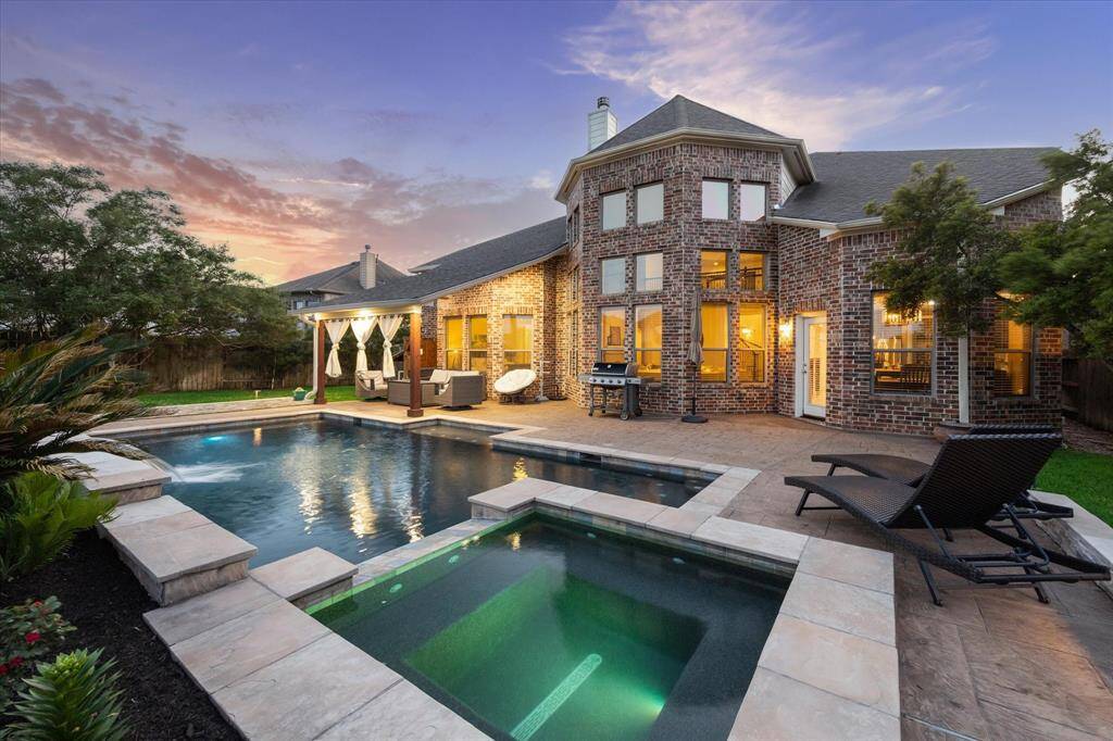 Enjoy the magic of golden hour from the built-in spa or poolside loungers. The architecture of the home provides a picturesque backdrop to this tranquil oasis with plenty of space to unwind or host family and friends.