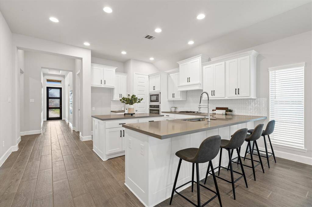 Kitchen offers additional seating, perfect for quick bites.