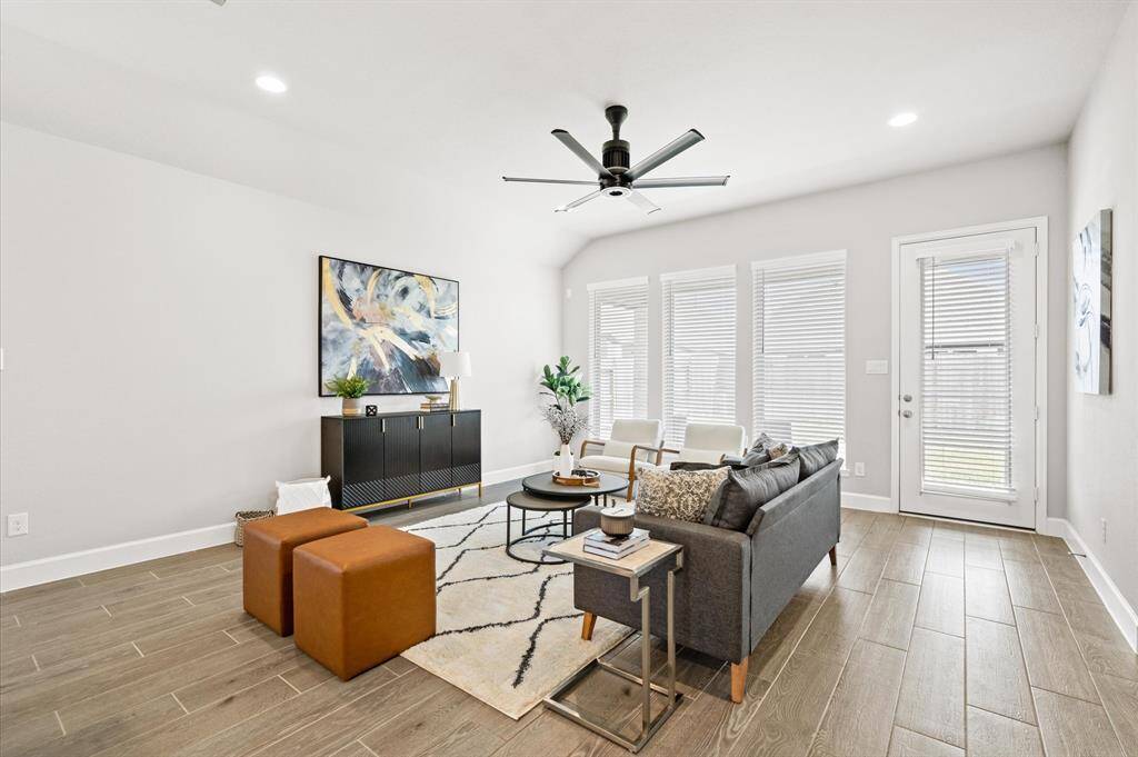 Family room with upgraded ceiling fan.