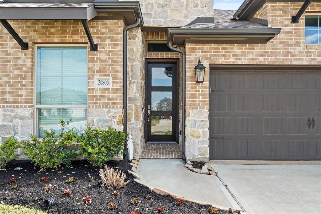 Stunning beveled glass door leads the way.