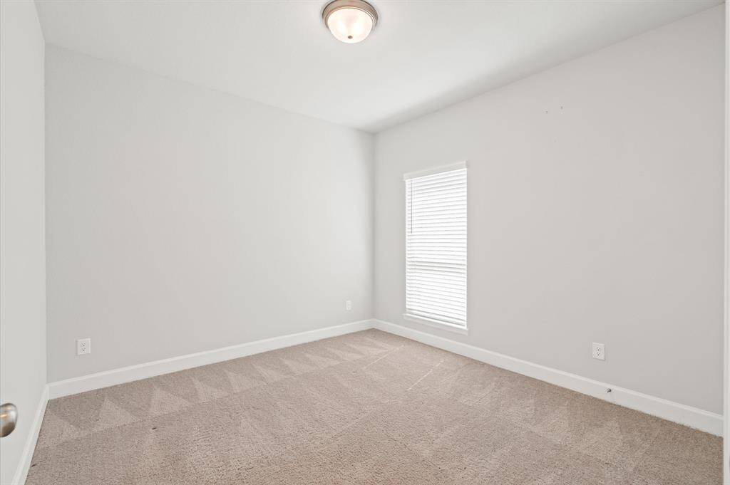 Secondary bedroom with walk-in closet.