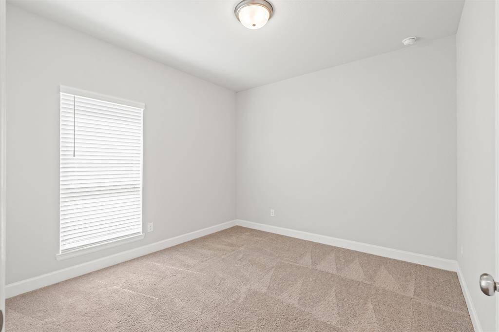Secondary bedroom with walk-in closet.