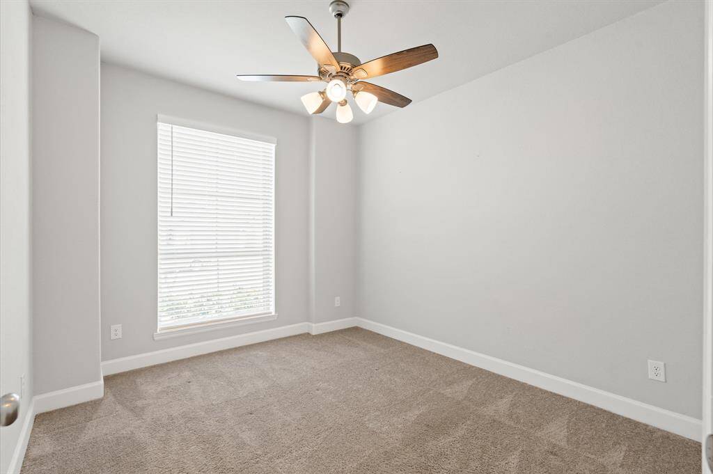 Secondary bedroom located to the left upon entry with private bathroom and nice walk in closet.