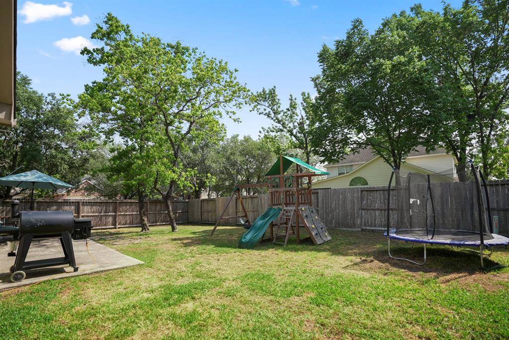 This view of the yard offers another perspective, showcasing the expansive space that provides endless possibilities for outdoor enjoyment and potential future landscaping projects.