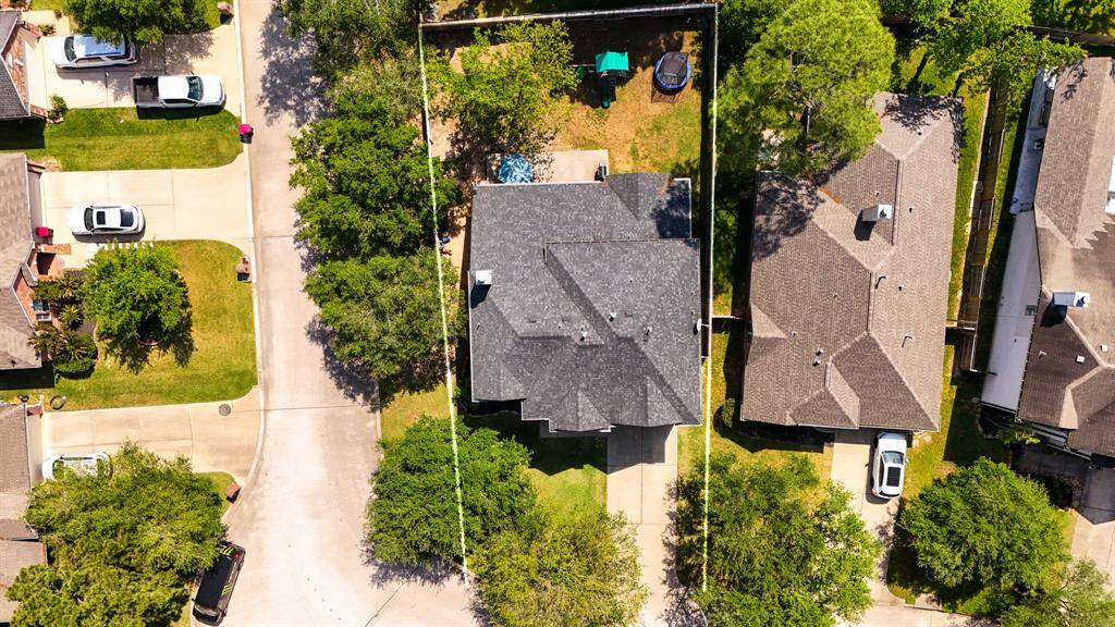 A bird’s-eye view directly above the home, showcasing the spacious corner lot. This perspective highlights the property’s generous size and prime location within the Windrose community, offering plenty of room for both outdoor living and privacy.