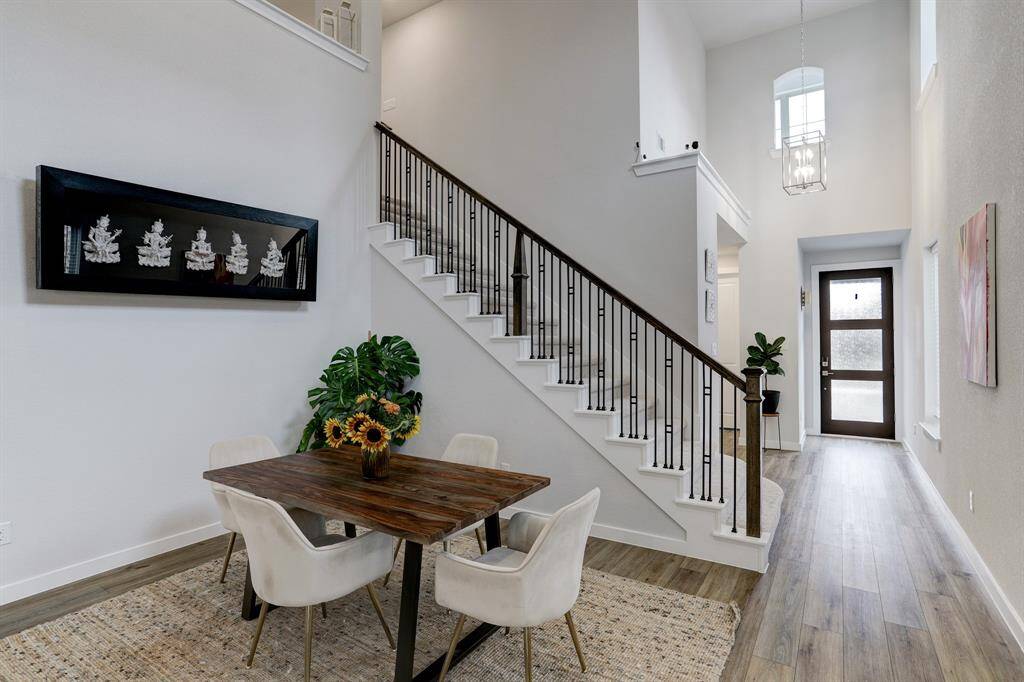 This energy-efficient home features soaring ceilings and vast windows that provide abundant natural light.