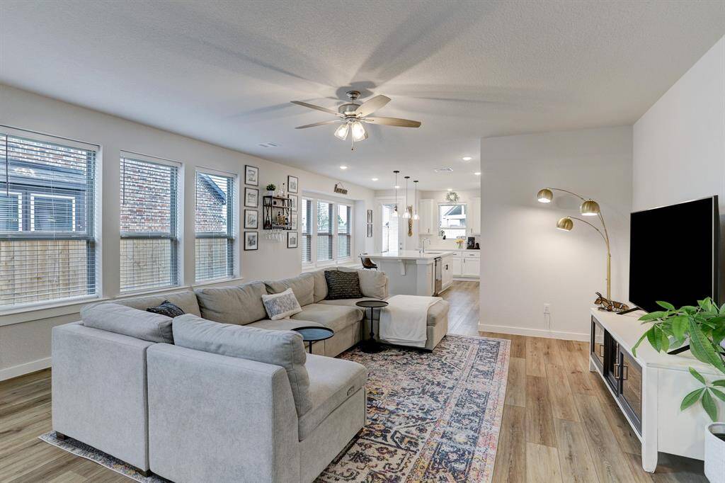 Energy-efficient windows provide rich natural light throughout the 1st-floor living area.
