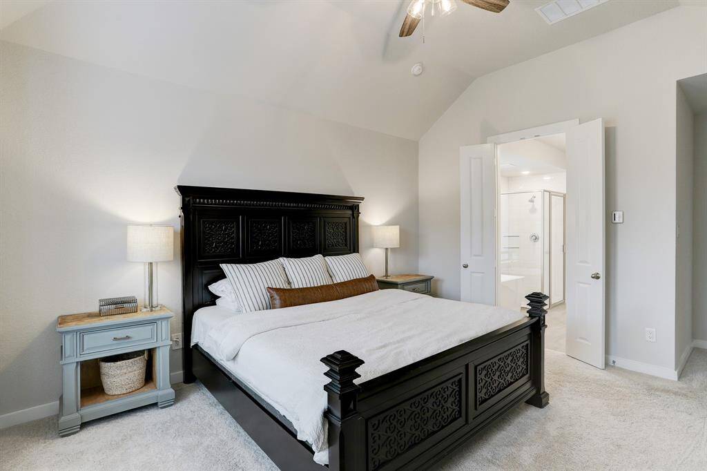 The primary suite features vaulted ceilings and ensuite bath.