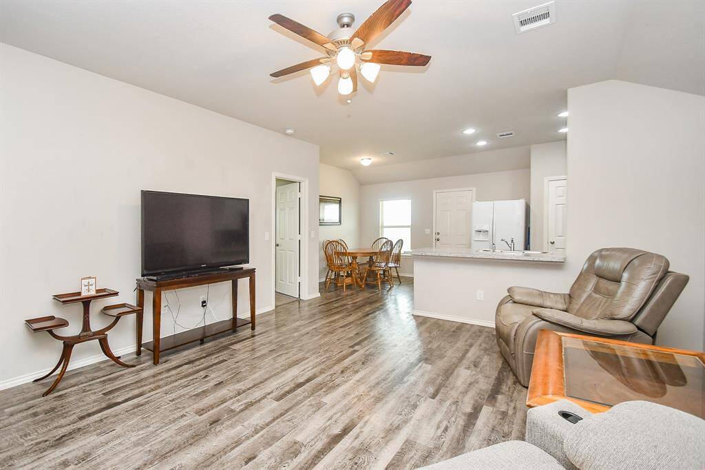 High Ceilings. Large Living Area. Vinyl Wood Plank Floors.