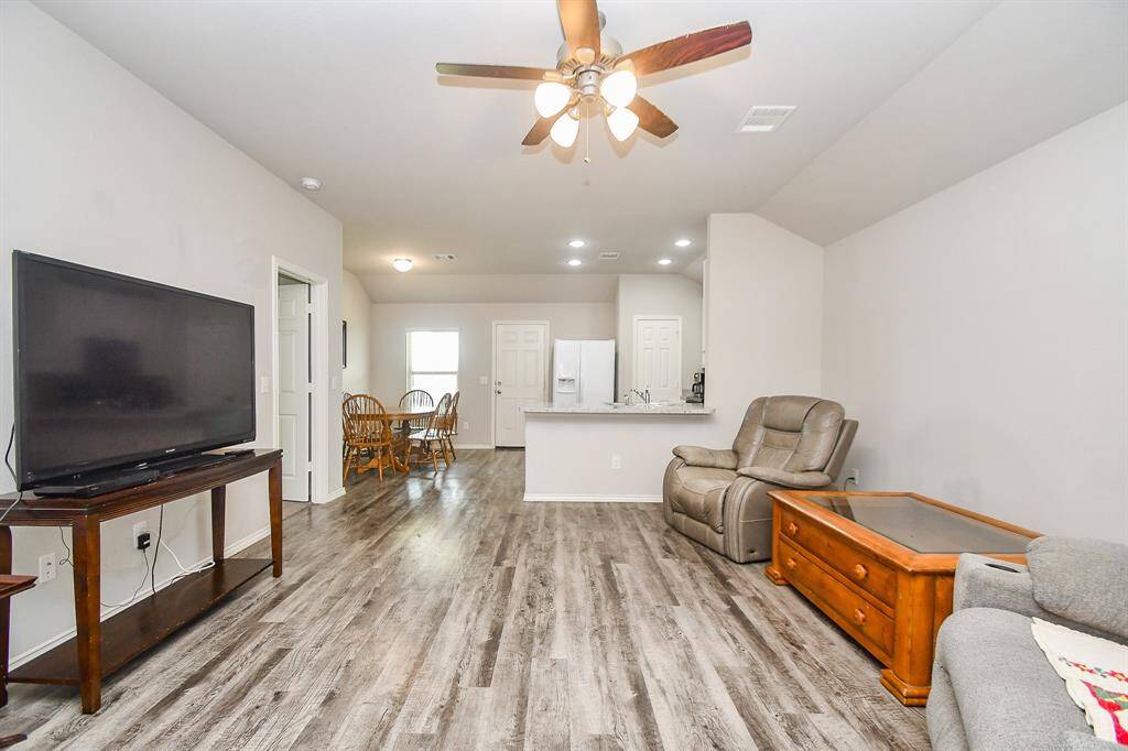 High Ceilings. Large Living Area. Vinyl Wood Plank Floors.