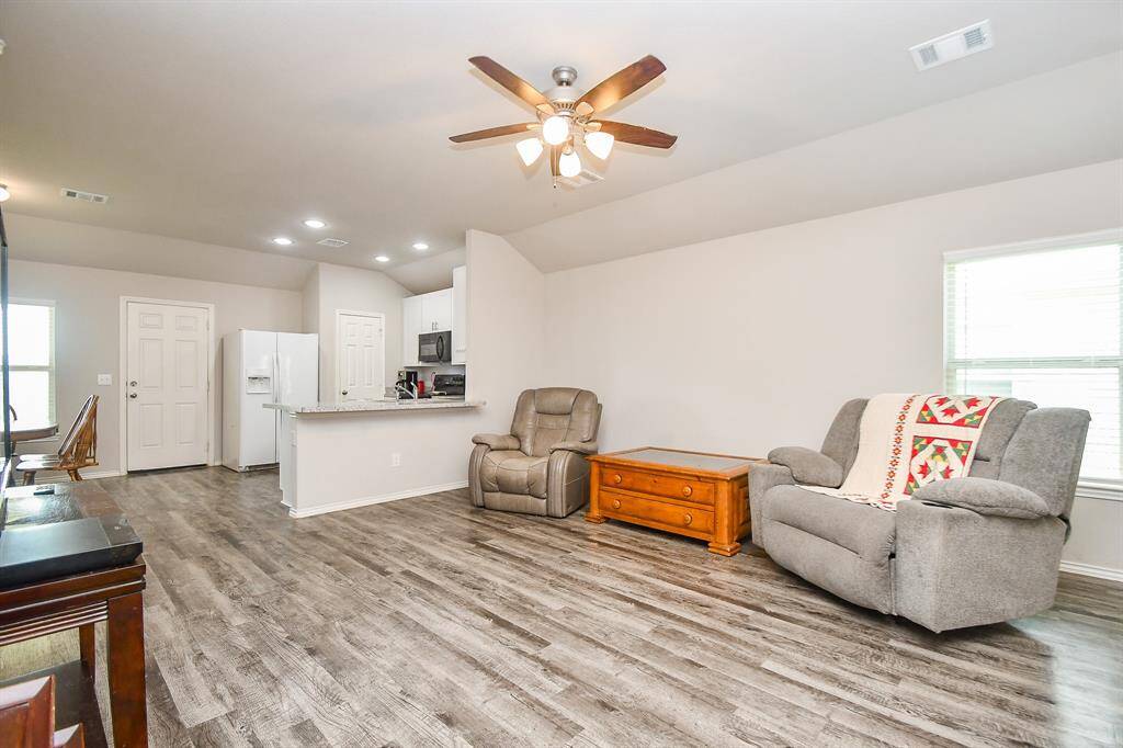 High Ceilings. Large Living Area. Vinyl Wood Plank Floors.