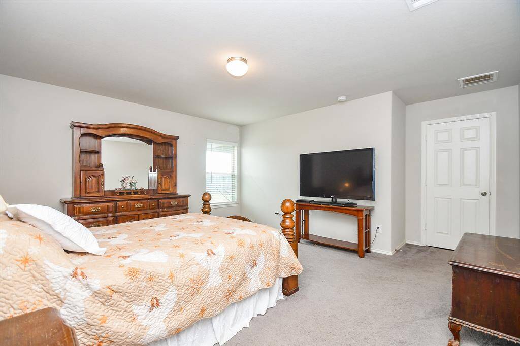 Approx. 16x17 Primary Bedroom with Large Walk-In Closet and an En-Suite Bath.