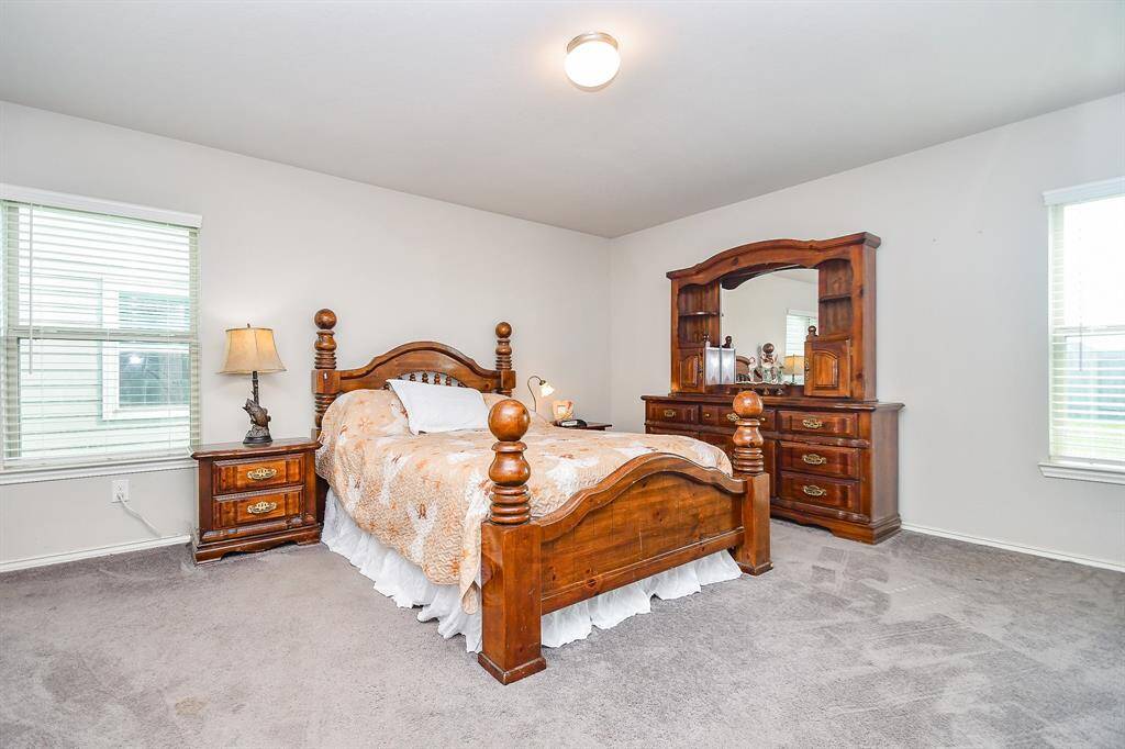 Approx. 16x17 Primary Bedroom with Large Walk-In Closet and an En-Suite Bath.