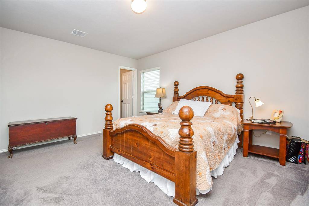 Approx. 16x17 Primary Bedroom with Large Walk-In Closet and an En-Suite Bath.